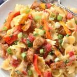 This Cheesy Sausage and Peppers Pasta is made in one pot and is one of our dinner time favorites. It's so easy to make and is perfect for busy weeknights!