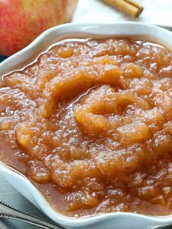 A close up of a bowl of applesauce