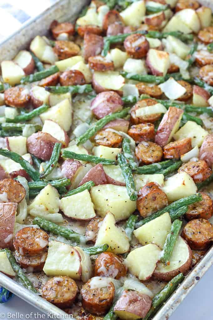 A dish is filled with food, with Sausage and Potatoes