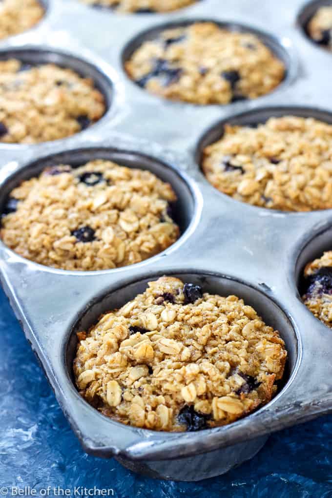 A muffin pan with blueberry oatmeal cups
