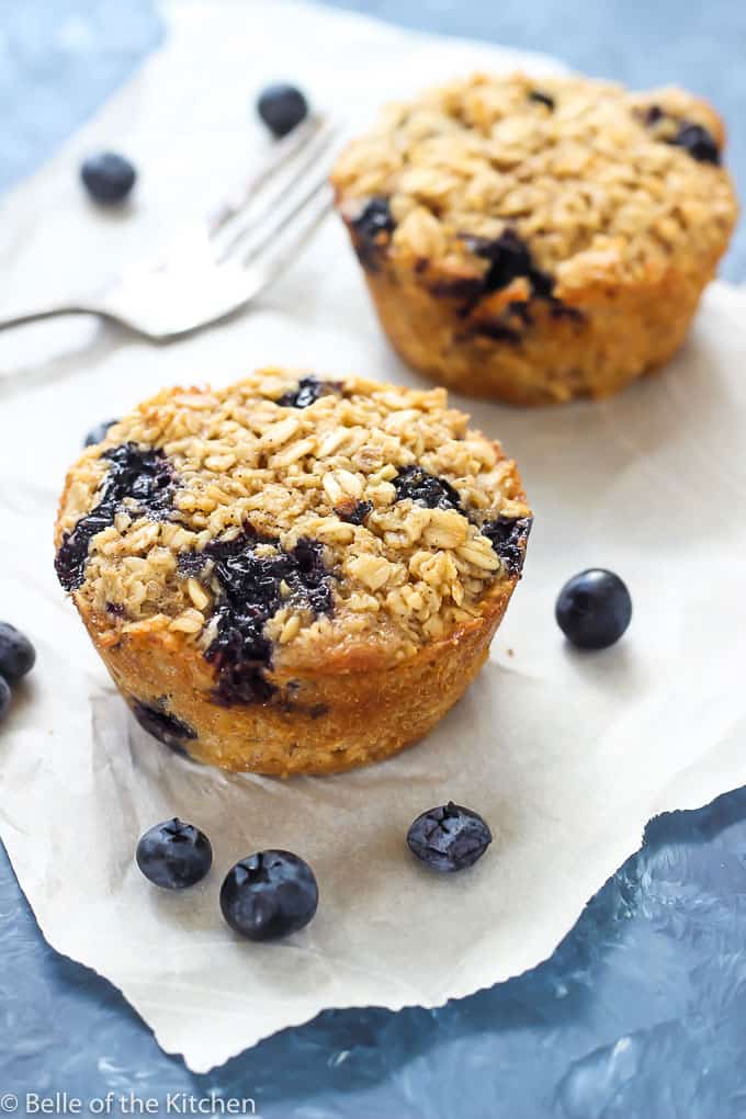blueberries next to individual baked oatmeal cups
