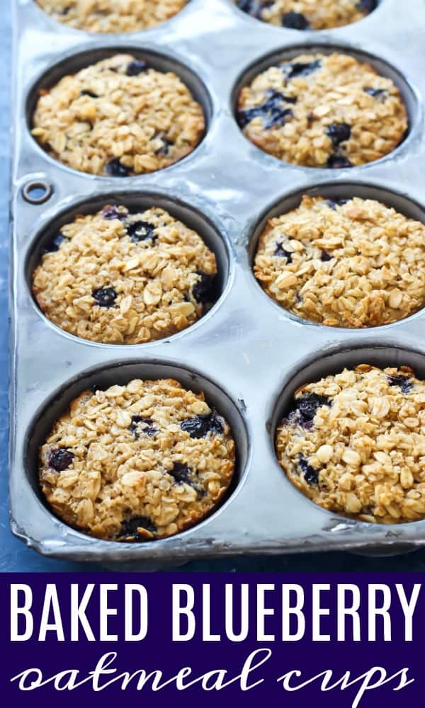 a muffin tin filled with baked blueberry oatmeal cups