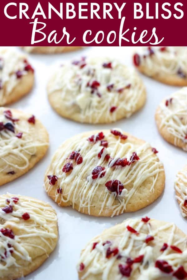 cookies with cranberries and icing on parchment paper
