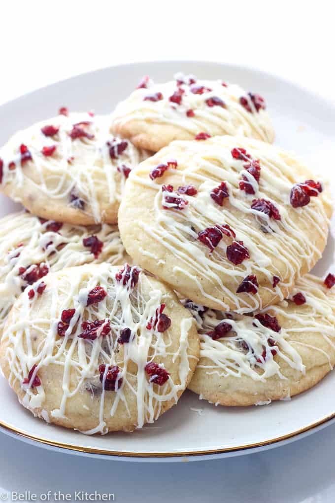 cookies with cranberries and icing on a plate