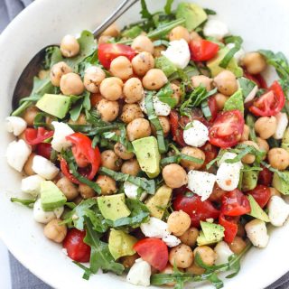 This Caprese Chickpea Salad is full of flavor and bursting with fresh ingredients like avocado, tomato, mozzarella, fresh herbs, and more. This makes a great vegetarian meal option for lunch or dinner thanks to the protein packed chickpeas.