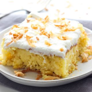 This Piña Colada Poke Cake is moist and delicious, and full of sweet tropical flavors. It's the perfect treat for warmer weather, or anytime you need a pick-me-up!