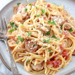 a plate of spaghetti with Italian sausage