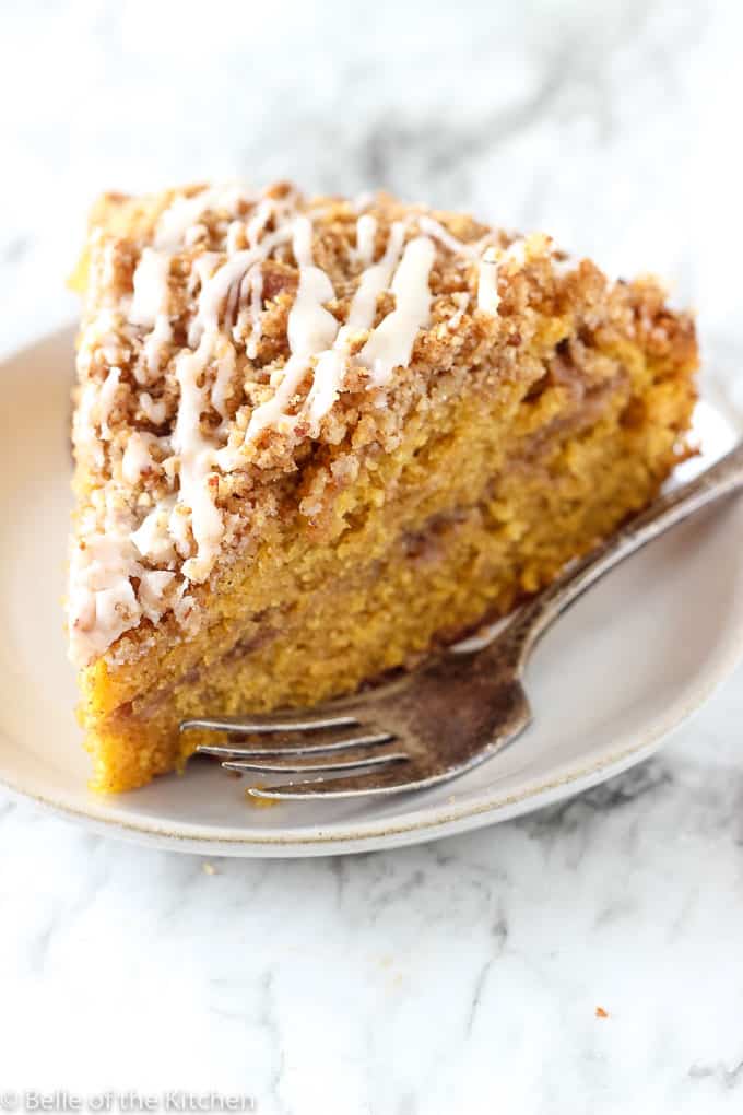 A piece of Coffee cake on a plate with a fork