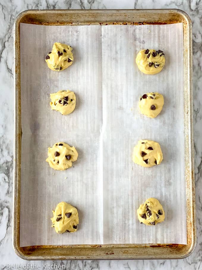cookie dough balls on a baking sheet 