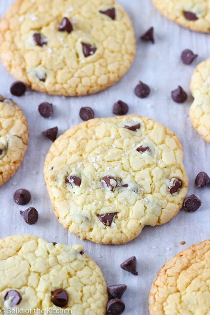 chocolate chips surrounding cookies on parchment paper