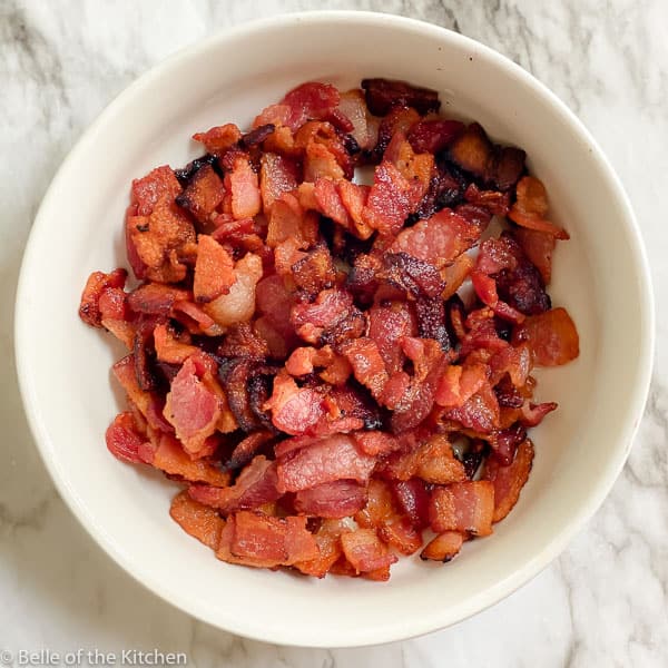 white bowl of chopped fried bacon