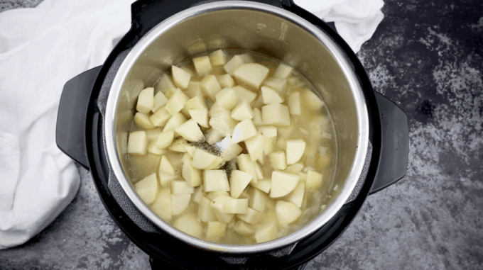 chopped potatoes and chicken broth in an Instant Pot