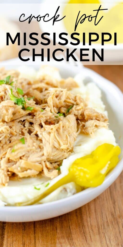 white bowl filled with mashed potatoes and shredded Mississippi chicken