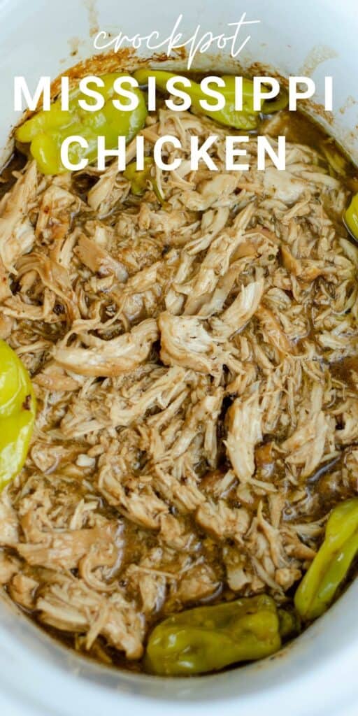 shredded chicken in a crockpot bowl surrounded by peperoncini peppers