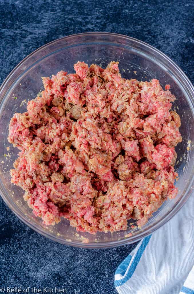 a bowl filled with ground meat