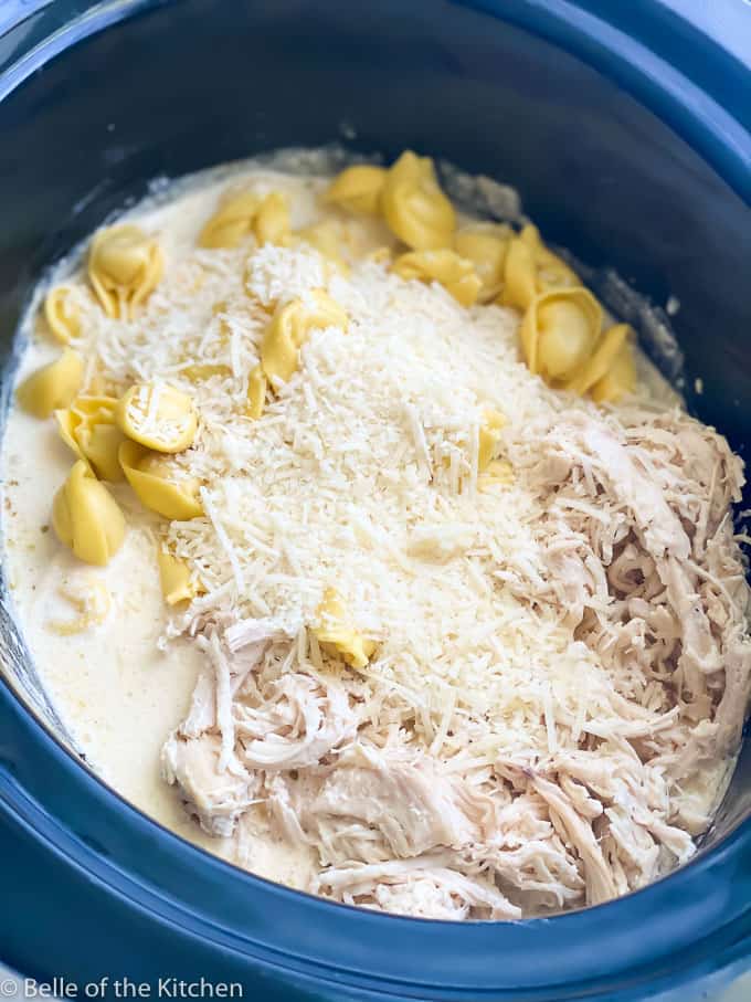 tortellini, cheese, and chicken in a crockpot