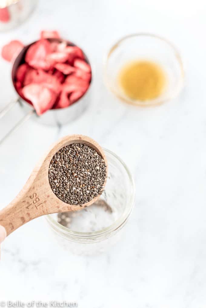 chia seeds pouring into a jar