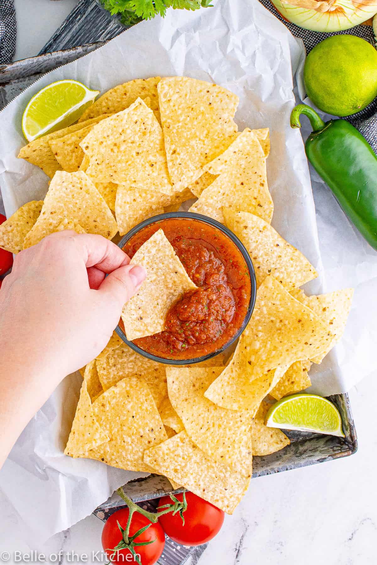 Mexican salsa recipe in a bowl surrounded by tortilla chips