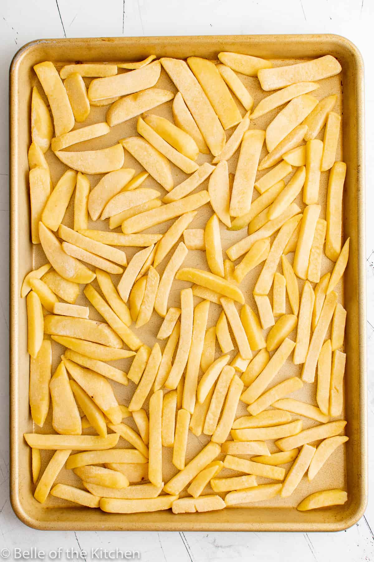 a sheet pan full of French fries