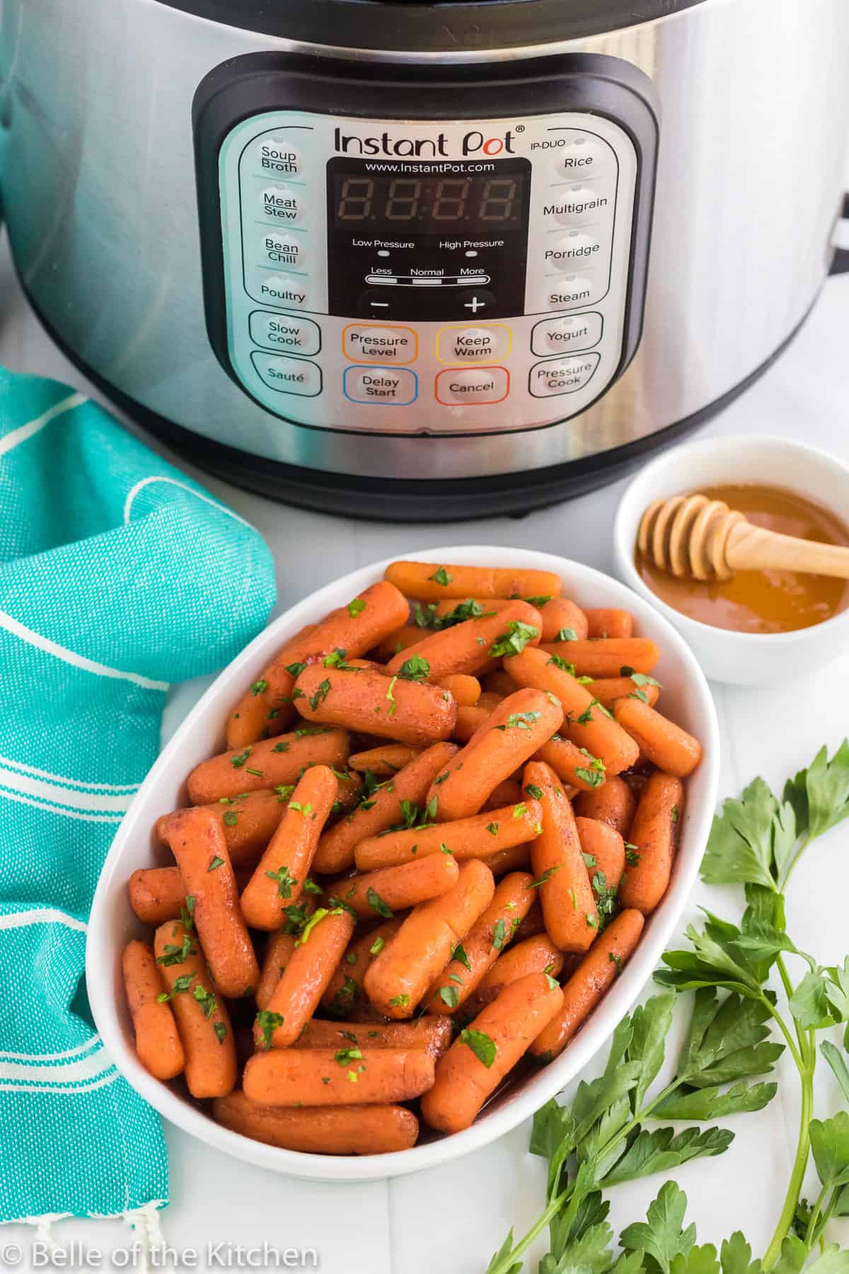 a bowl of carrots next to an instant pot