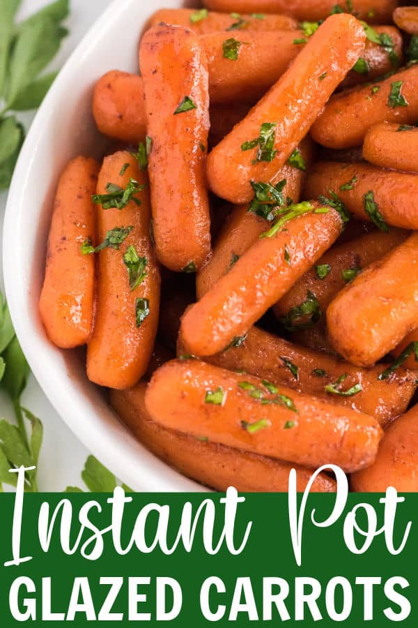 baby carrots in a white serving dish with parsley on top
