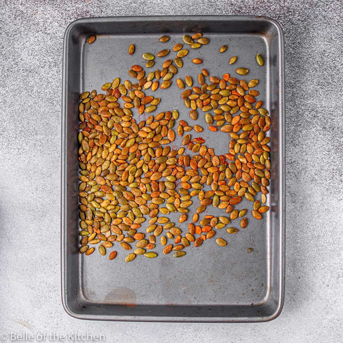 pumpkin seeds on a cookie sheet