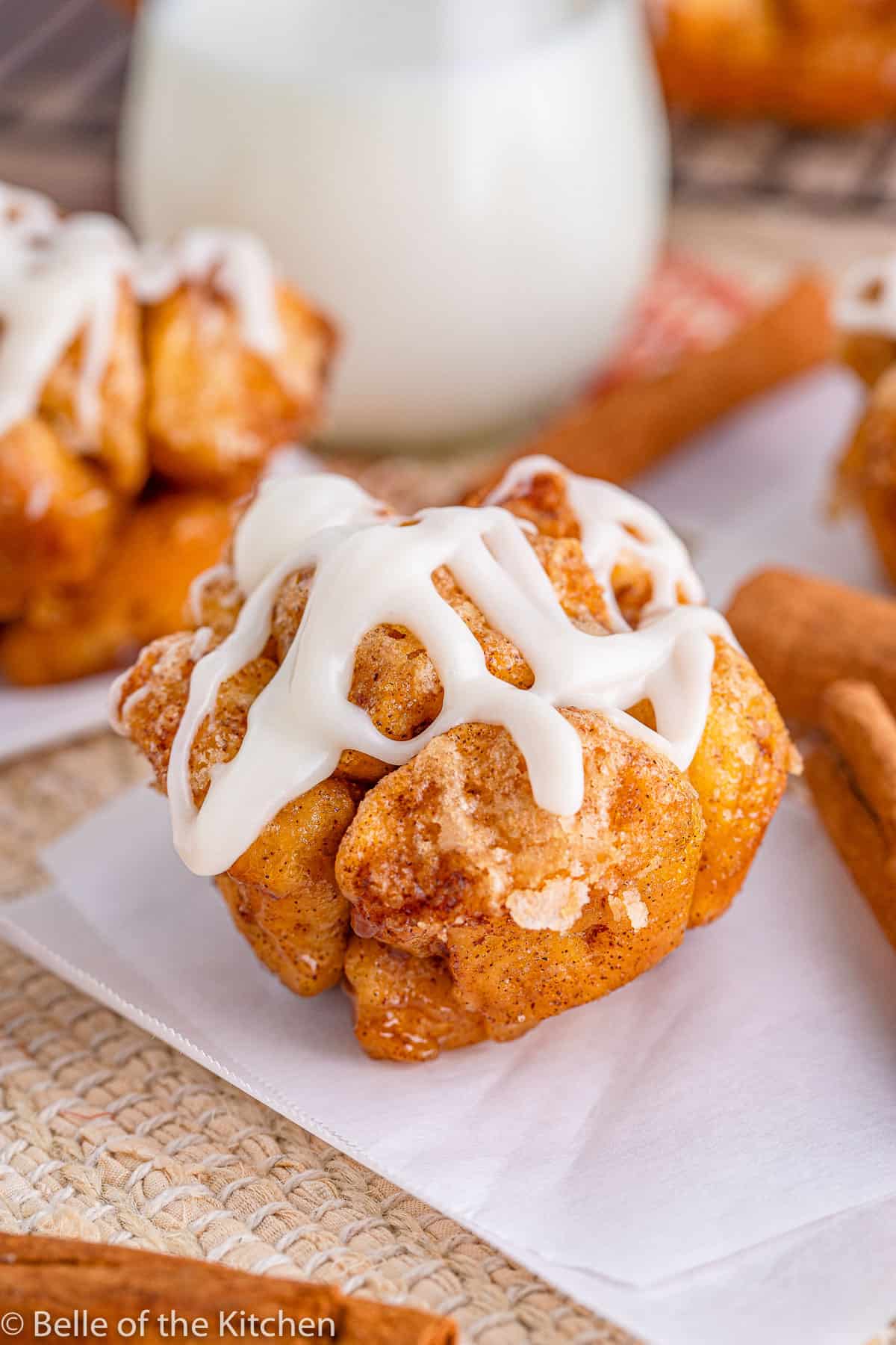 a monkey bread muffin with glaze on it