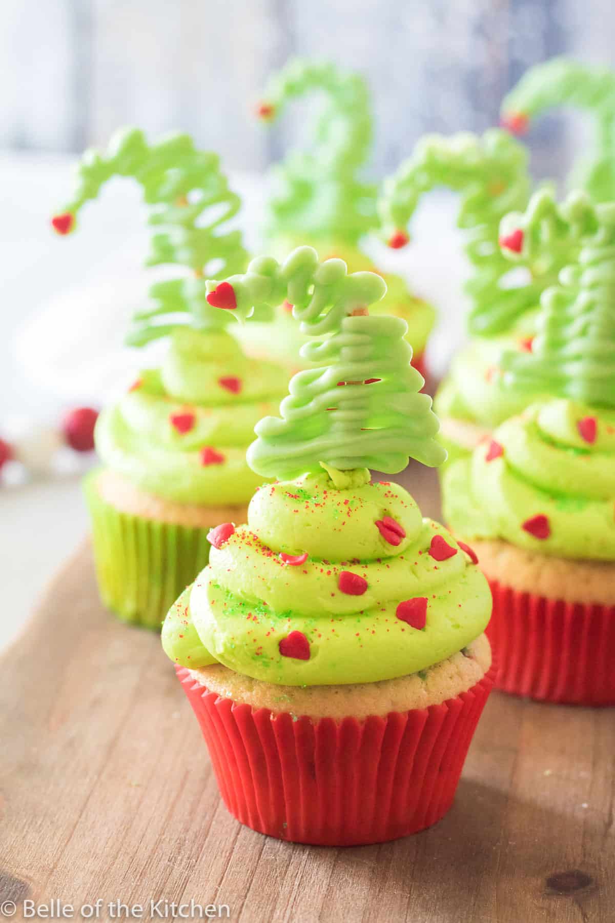grinch cupcakes on a cutting board
