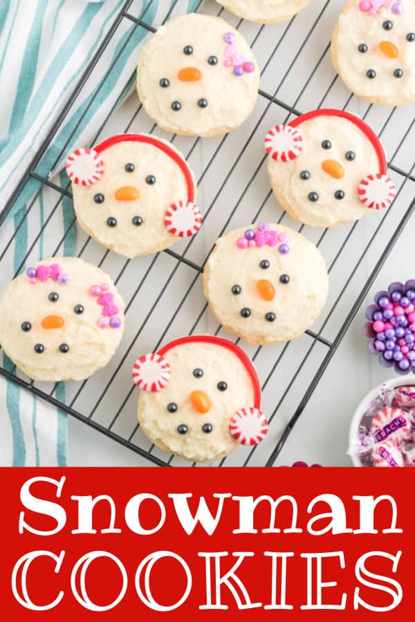 cookies decorated like snowmen on a wire rack