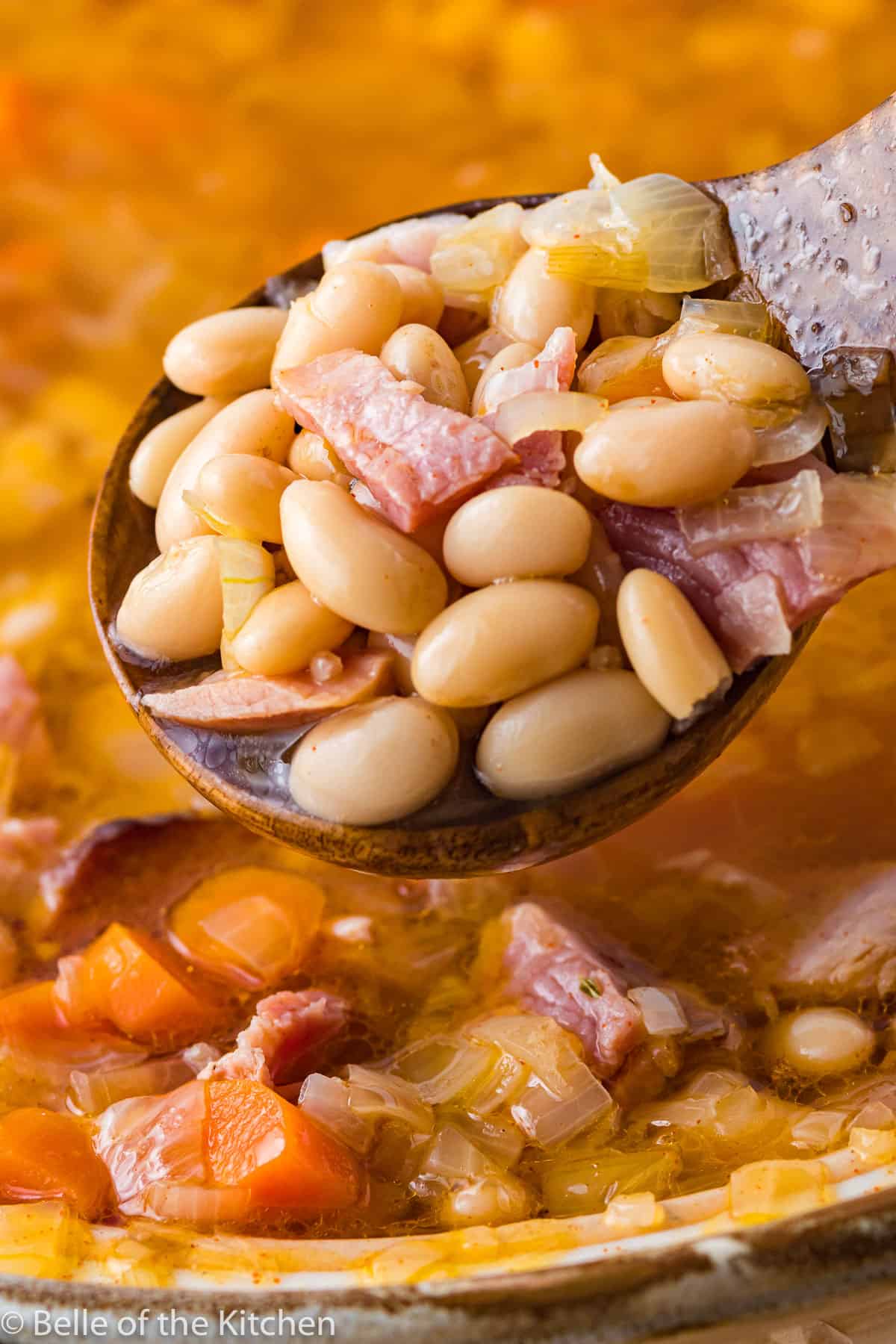 a ladle full of beans and ham