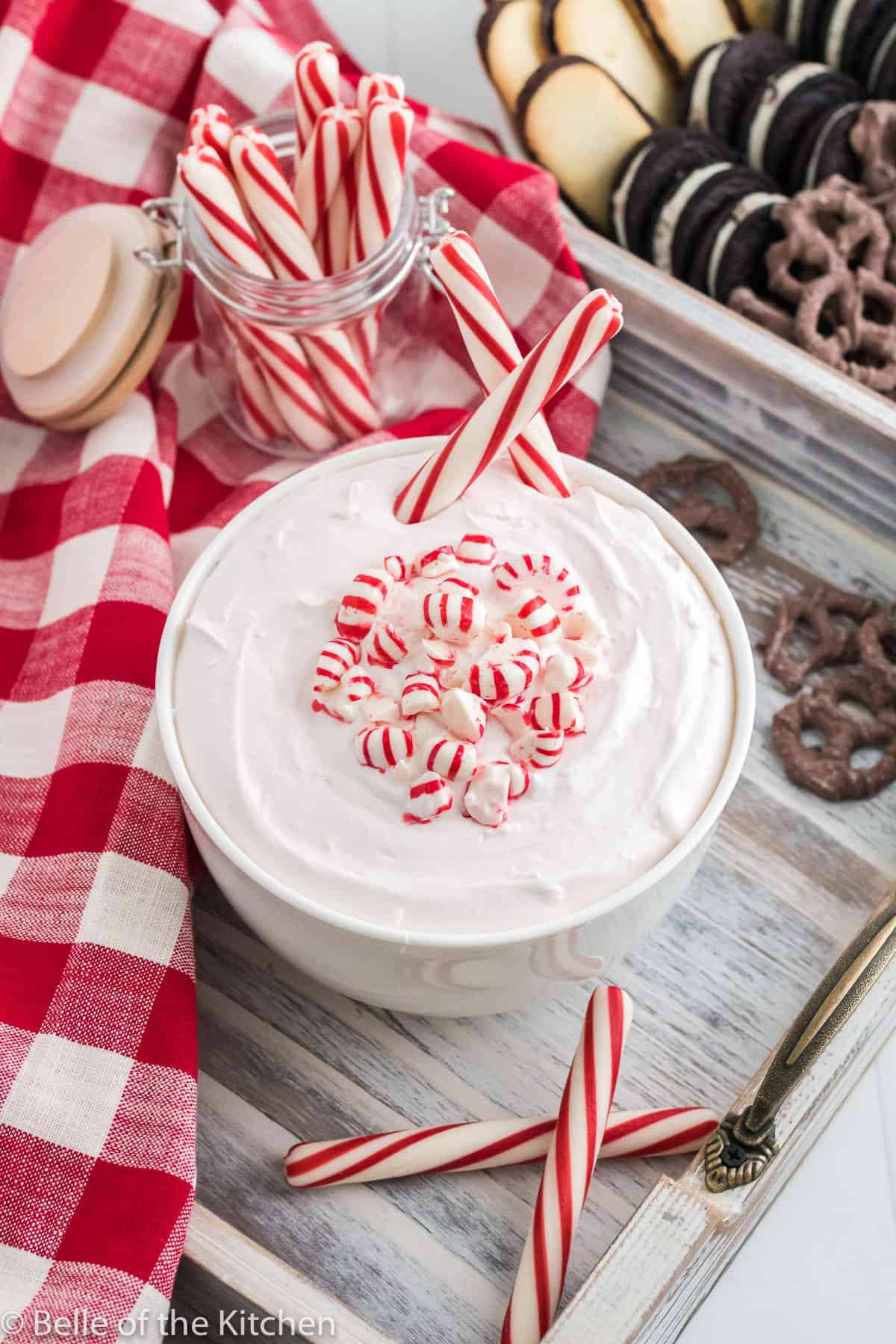 a white bowl holding peppermint cheesecake dip