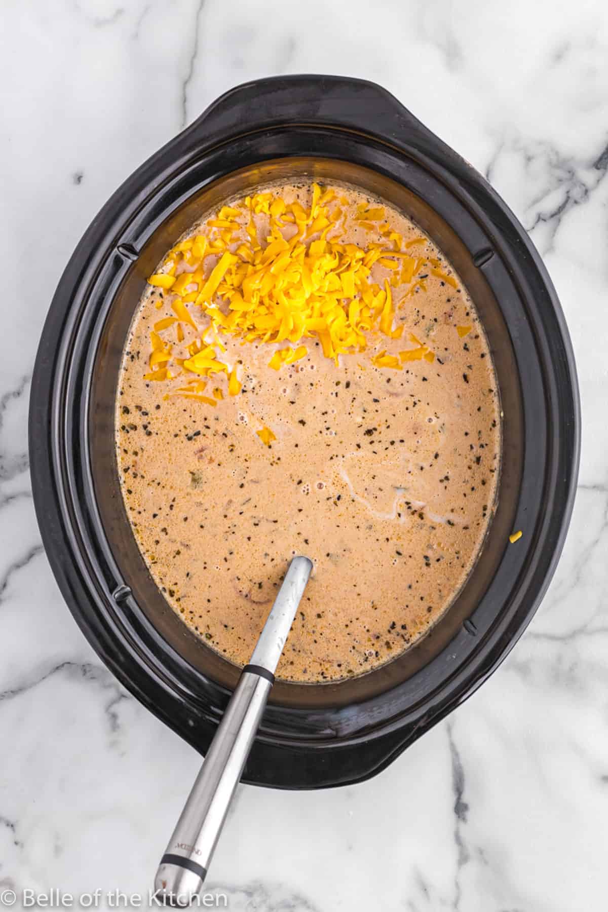 crockpot full of soup with cheese