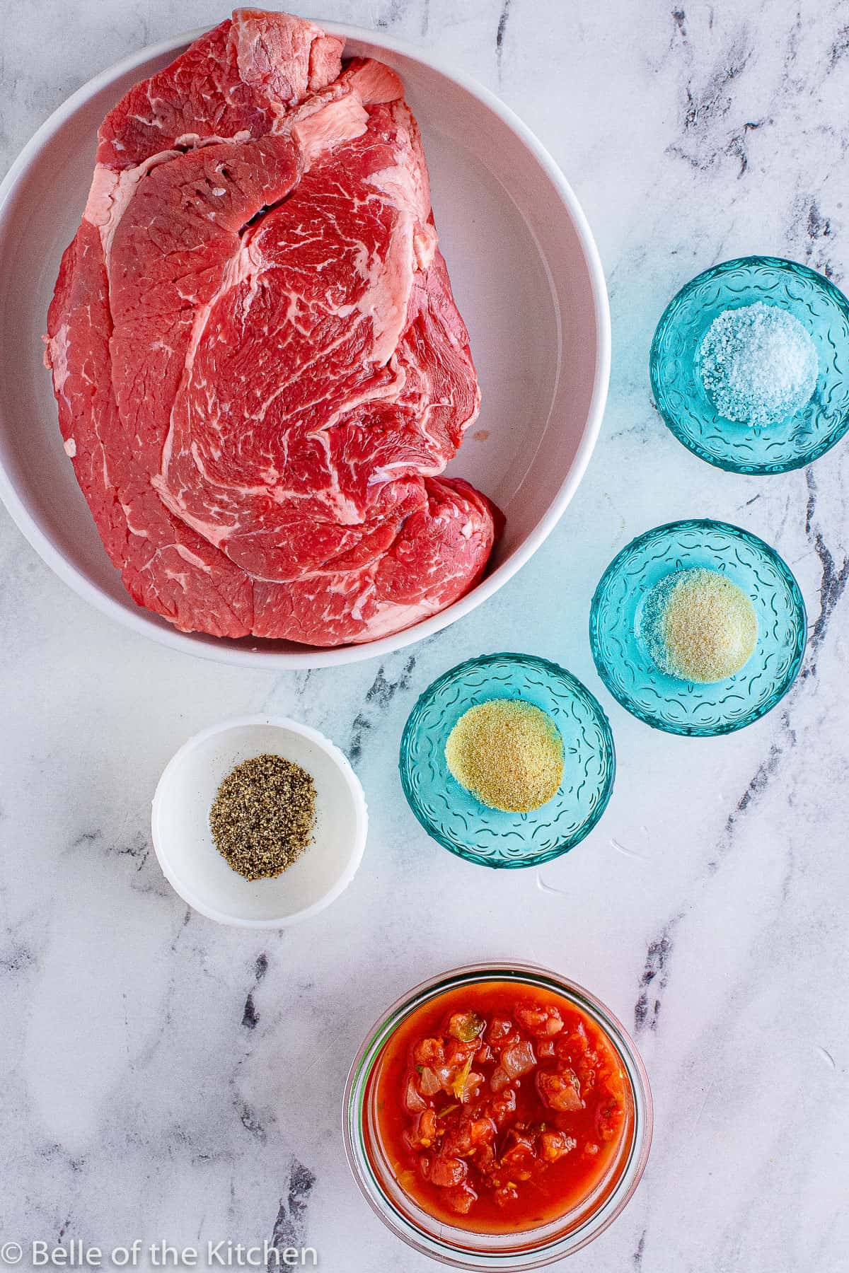 meat and seasonings on a counter top