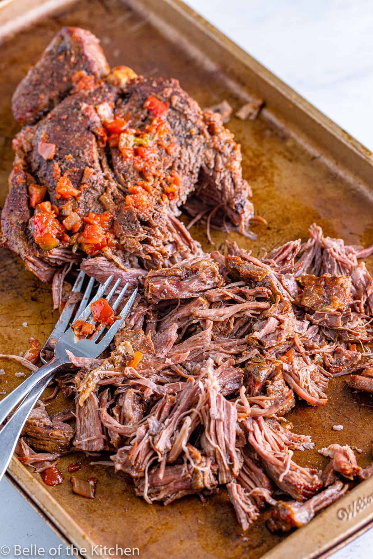 shredded beef on a cookie sheet