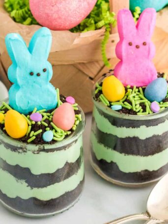 bunny peeps on top of cups of pudding