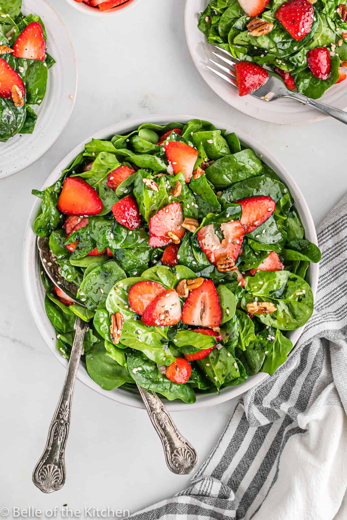 a salad bowl of strawberry spinach salad