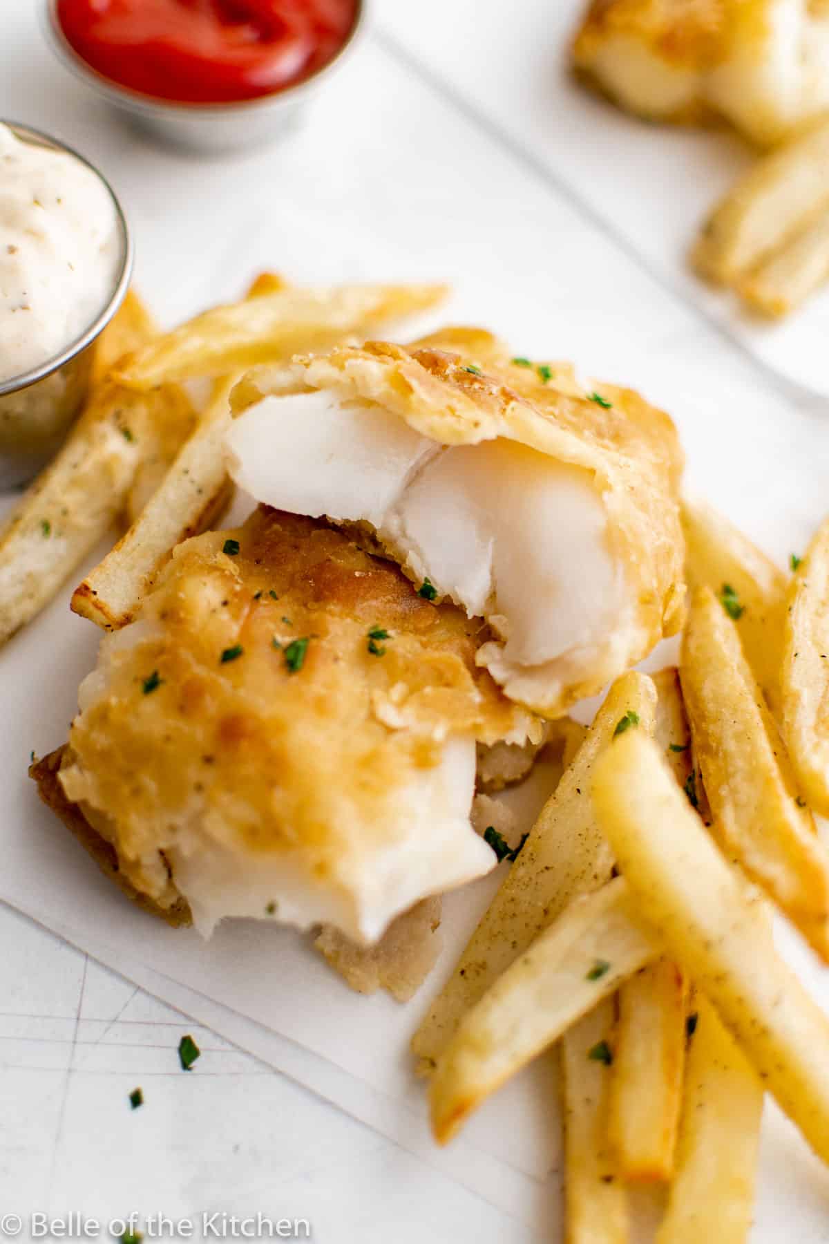 fried fish next to French fries
