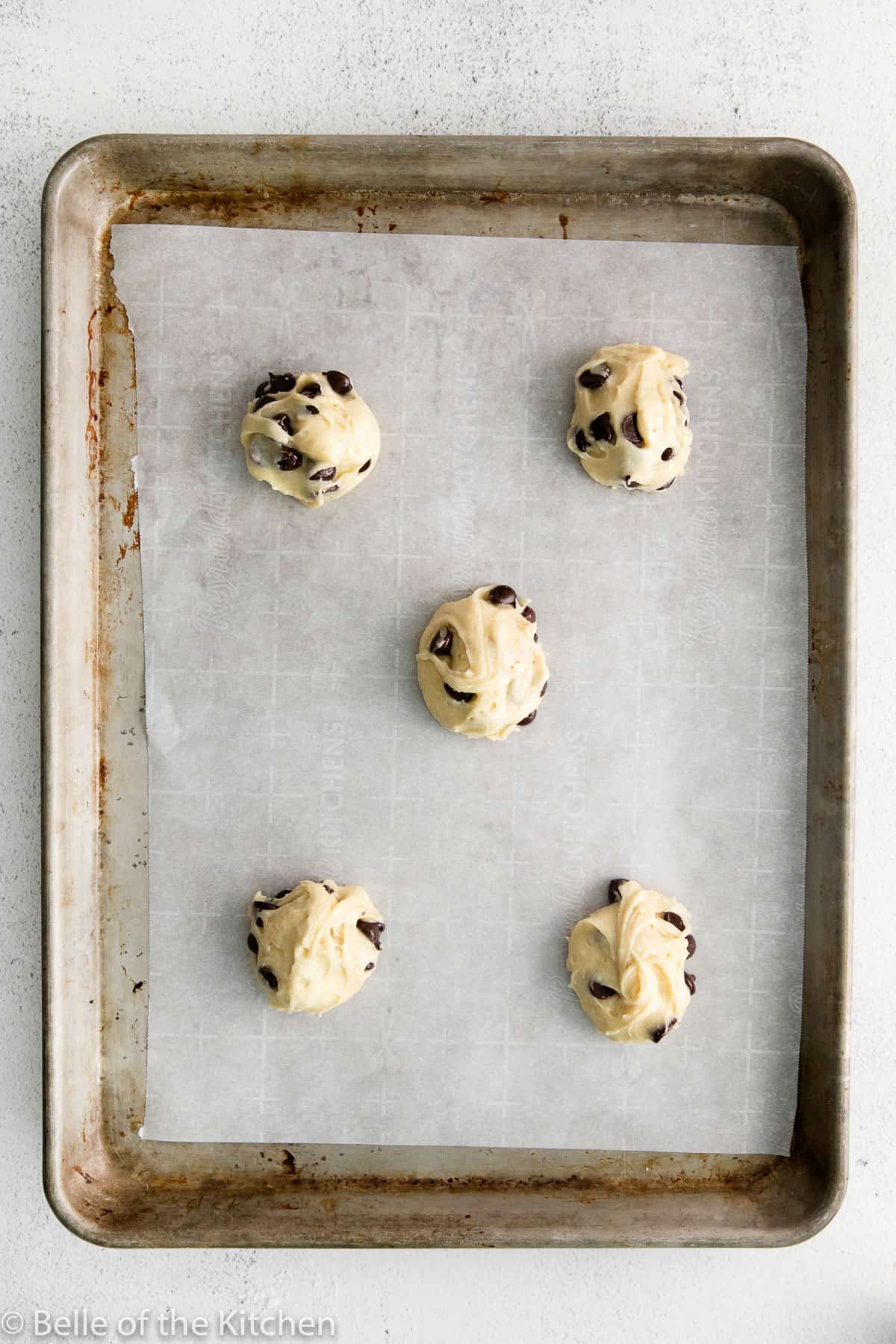 balls of cookie dough on a sheet pan