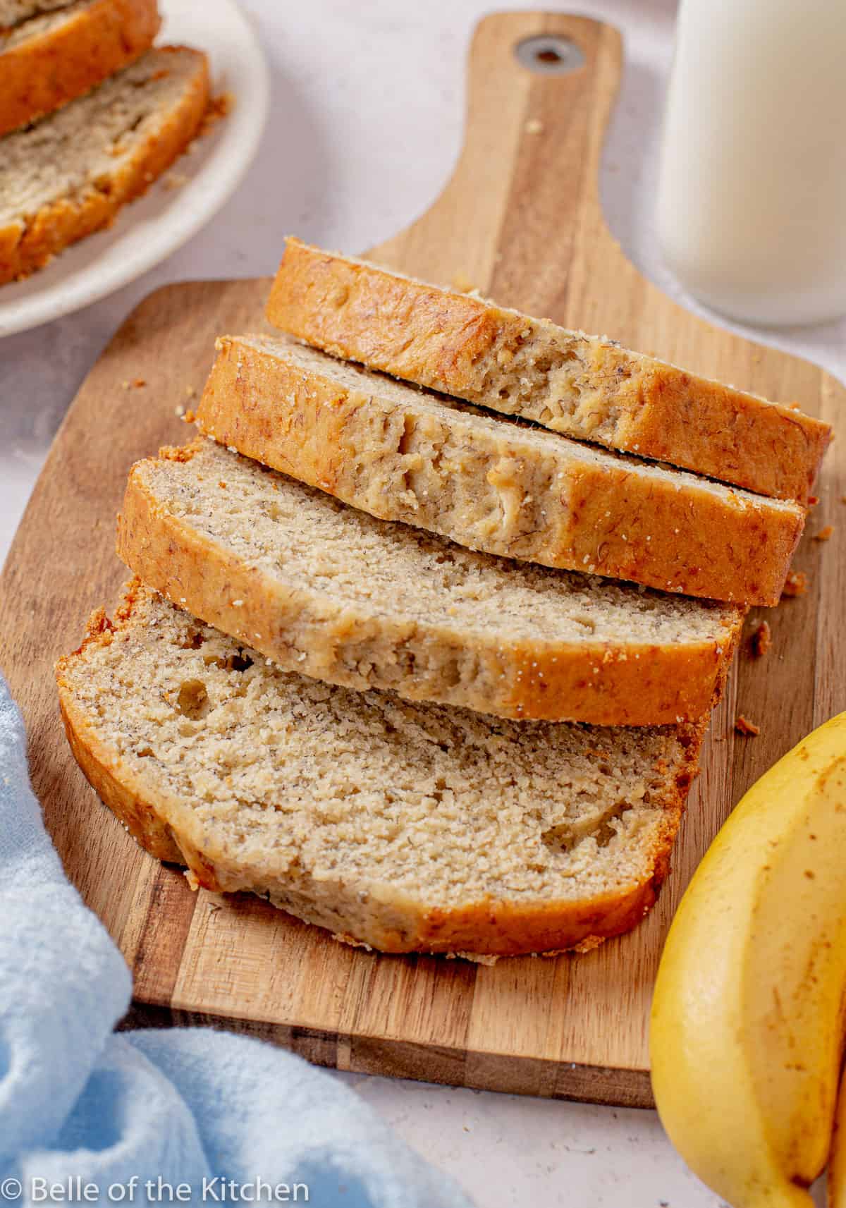 slices of banana bread on a wooden cutting board