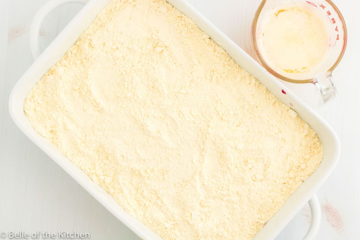 cake mix spread in a baking dish.