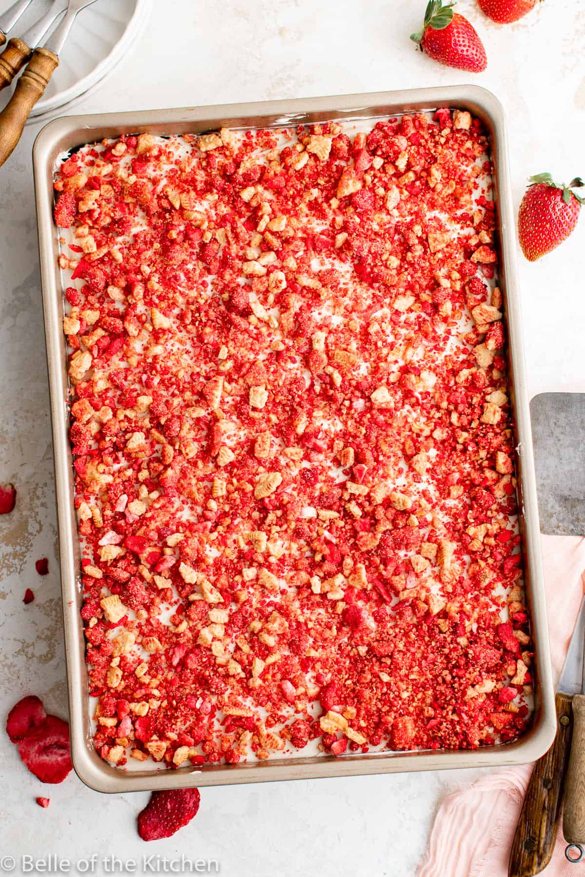 strawberry crunch cake in a rectangular baking pan.