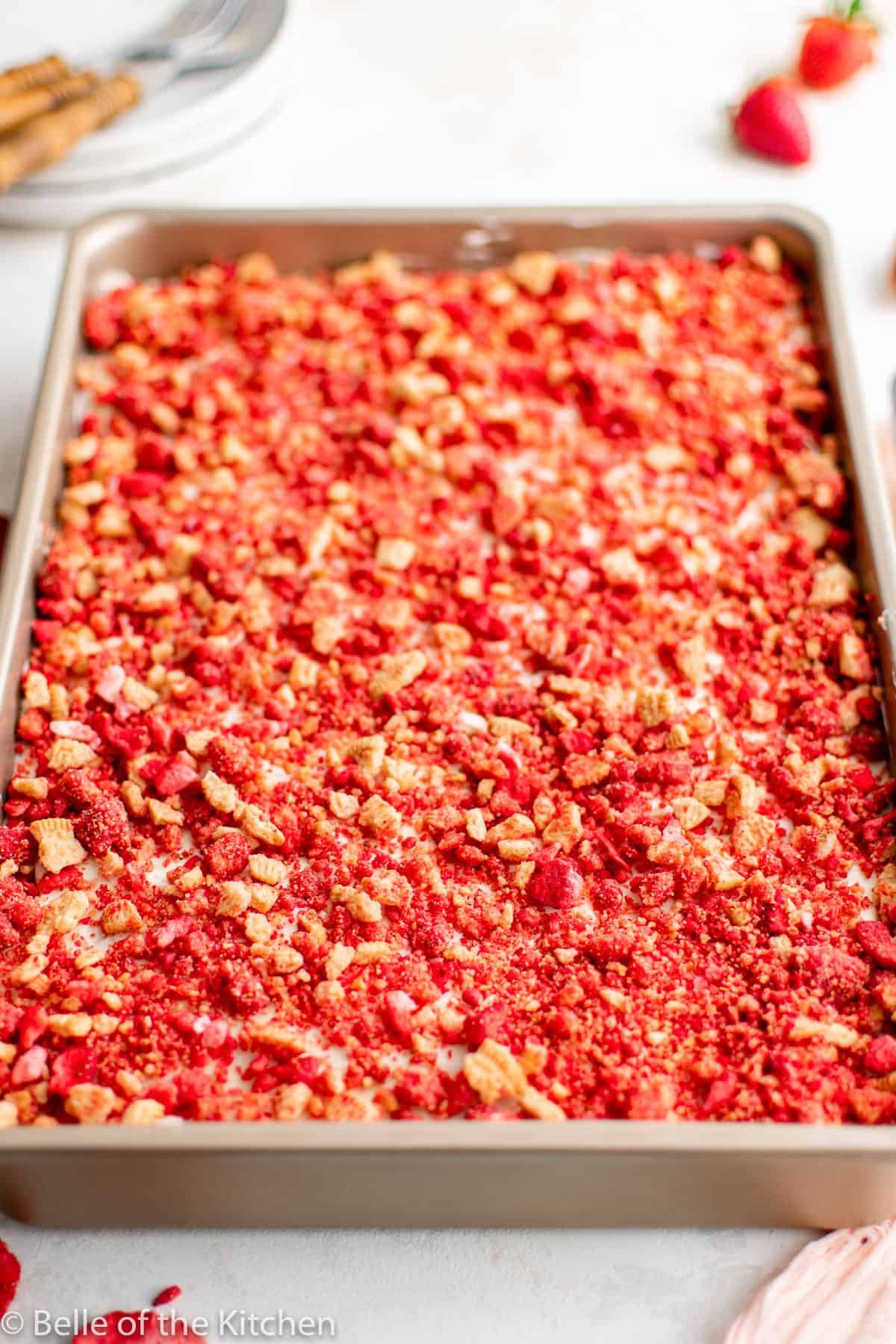 strawberry crunch cake in a rectangular baking pan.
