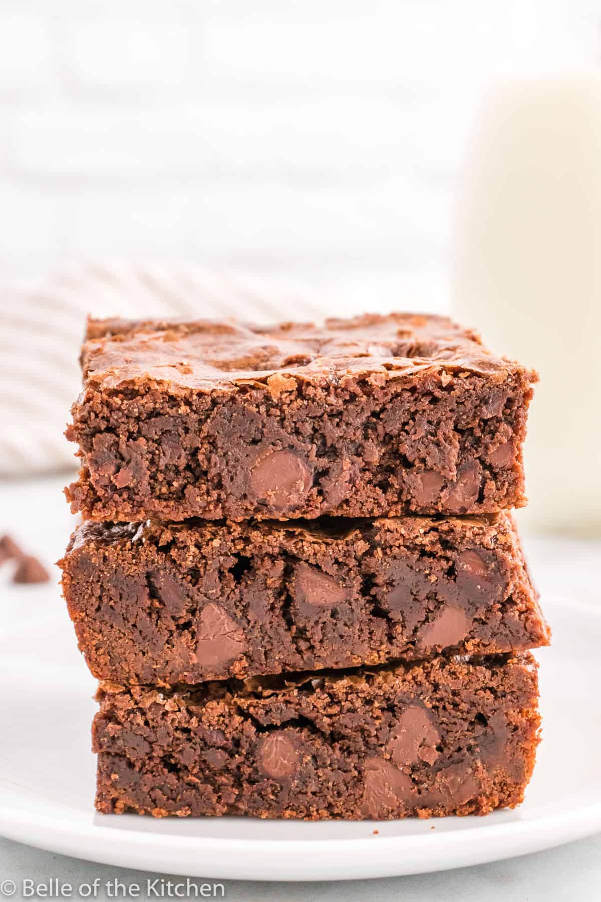 a stack of brownies on a plate.