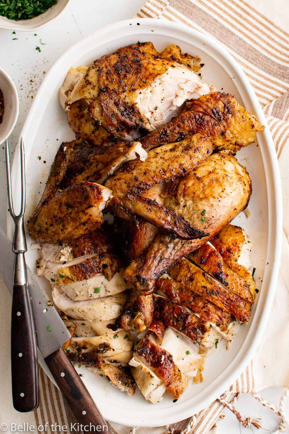 cut up chicken on a platter.