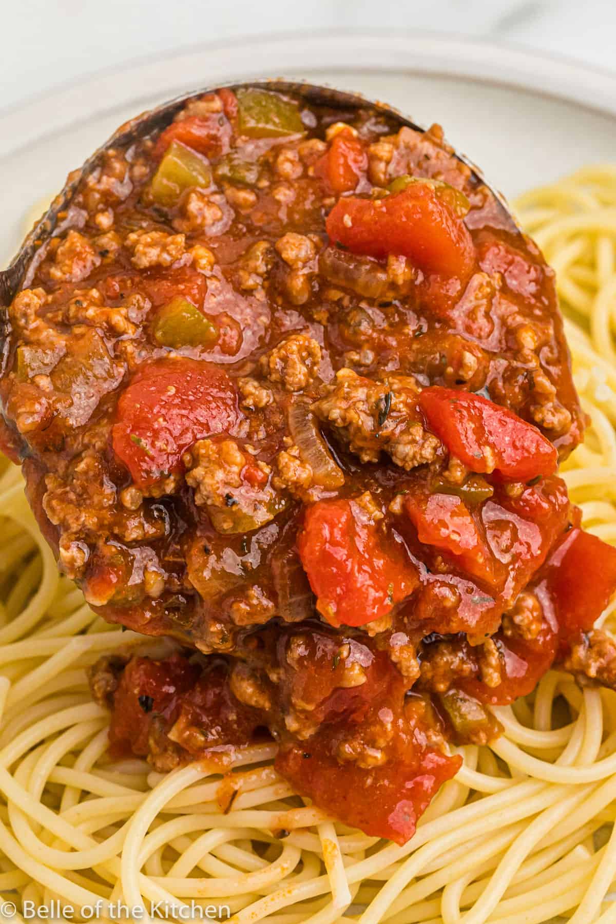 spaghetti sauce spooned over noodles.