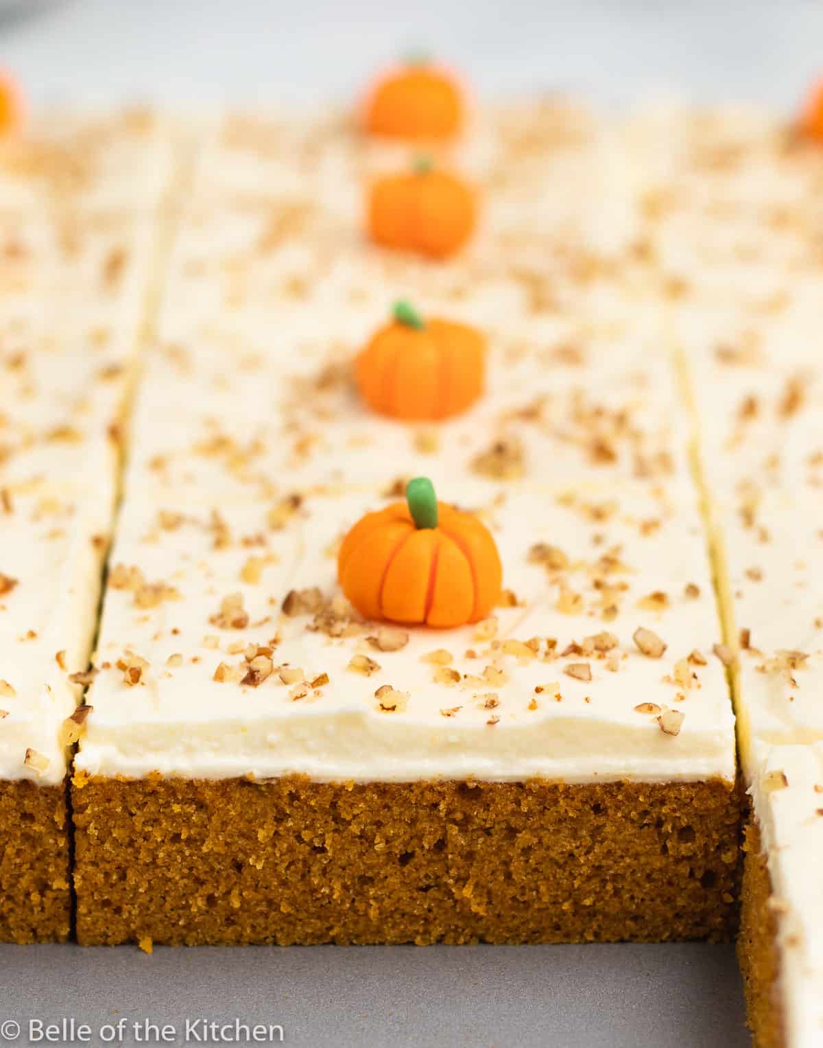 pumpkin cake in a pan cut into slices.