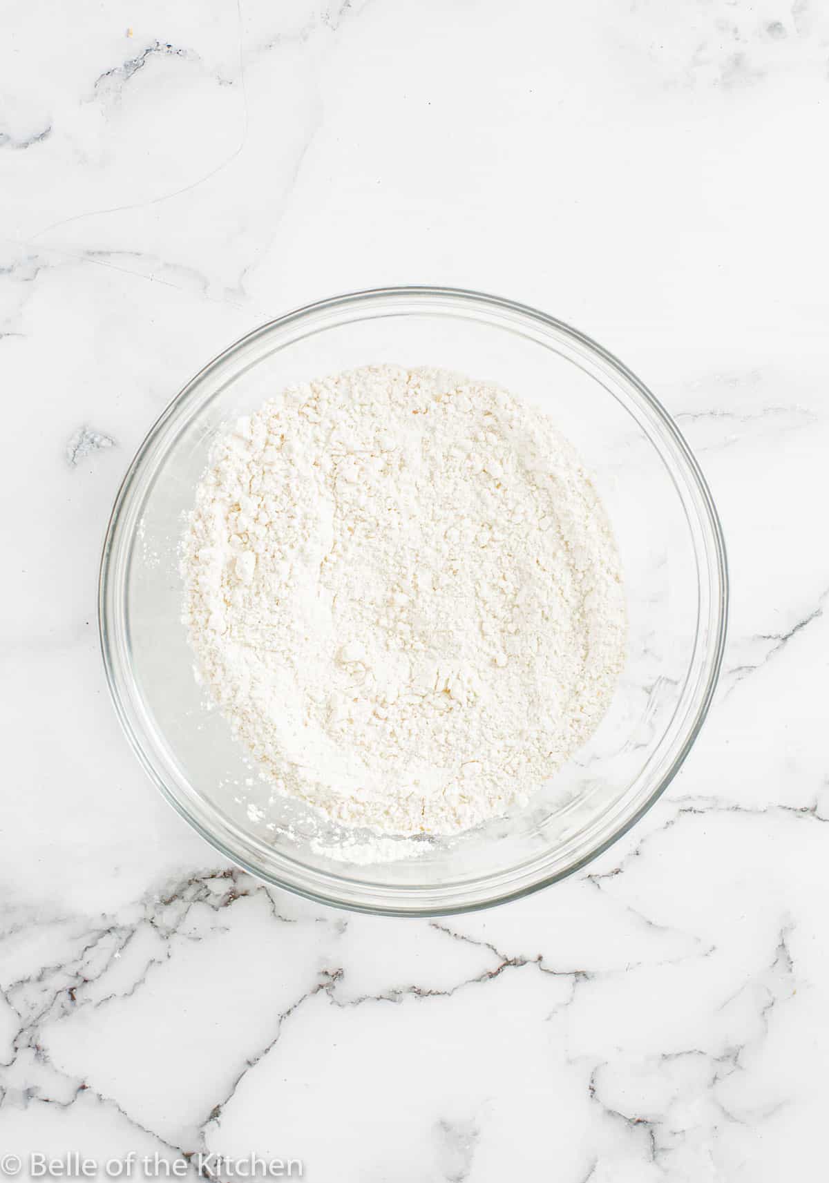a glass bowl of flour.