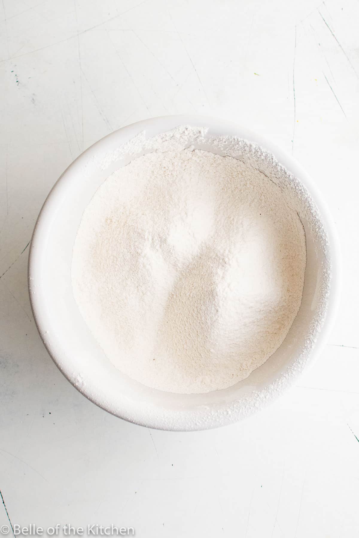 a white bowl of flour.