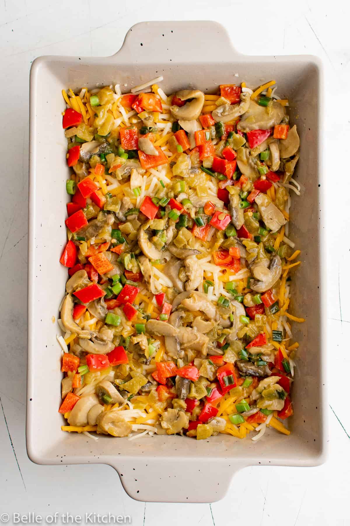 a baking dish full of mixed vegetables.
