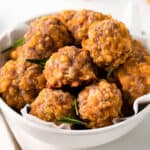 sausage balls in a white bowl.